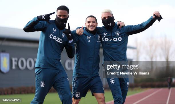 Ezri Konsa of Aston Villa in action with team mates Emi Buendia and Douglas Luiz during a training session at Bodymoor Heath training ground on...