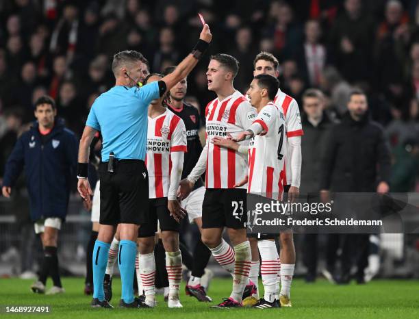 Mauro Junior of PSV Eindhoven is shown a red card by referee, Daniele Orsato during the UEFA Europa League knockout round play-off leg two match...