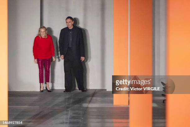 Fashion designers Miuccia Prada and Raf Simons walk the runway during the Prada Ready to Wear Fall/Winter 2023-2024 fashion show as part of the Milan...
