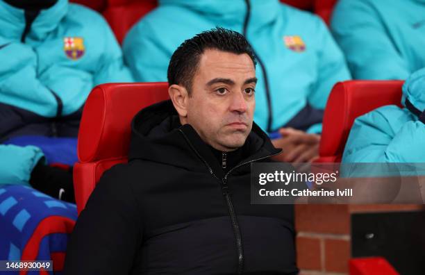 Xavi, Head Coach of FC Barcelona, looks on prior to the UEFA Europa League knockout round play-off leg two match between Manchester United and FC...