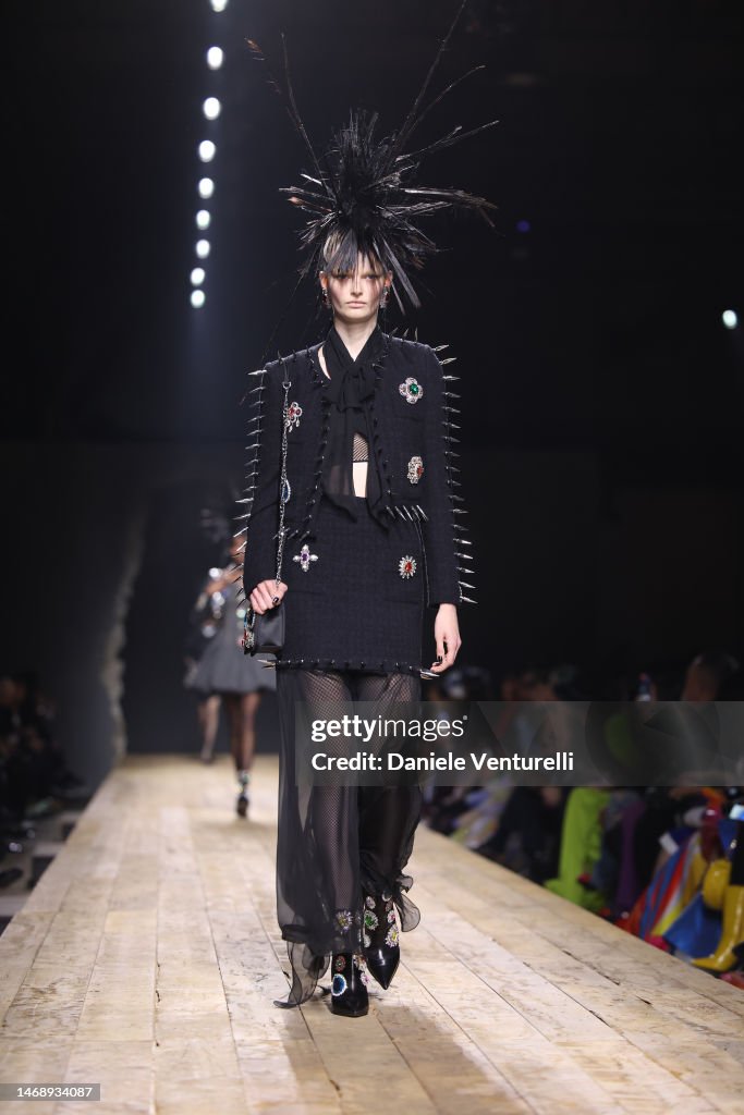a-model-walks-the-runway-at-the-moschino-fashion-show-during-the-milan-fashion-week-womenswear.jpg