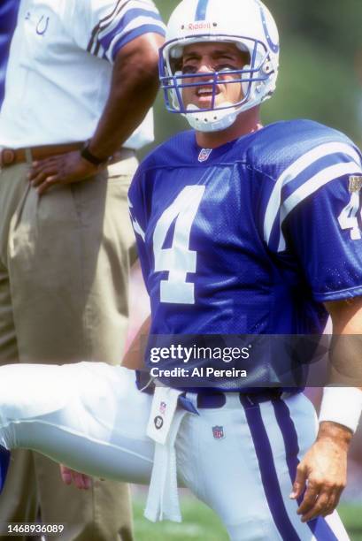 Quarterback Jim Harbaugh of the Indianapolis Colts follows the action in the Pro Football Hall of Fame Game between the New Orleans Saints vs the...