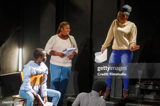 group of black drama students doing an improv exercise in an acting class - acting stock pictures, royalty-free photos & images