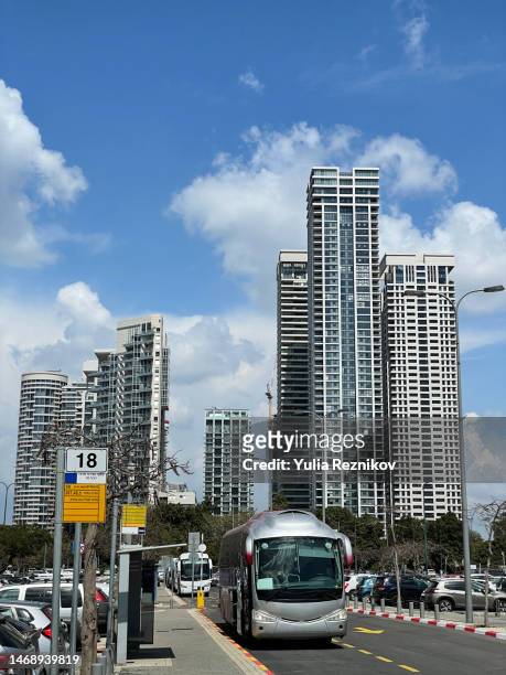 tel-aviv cityscape with modern buildings and public transport - tel aviv stock-fotos und bilder