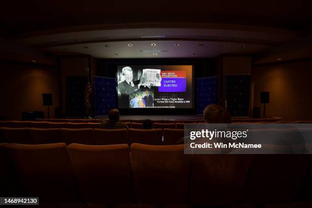 Visitors watch a short documentary on the life of former U.S. President Jimmy Carter at the Jimmy Carter Library and Museum February 23, 2023 in...