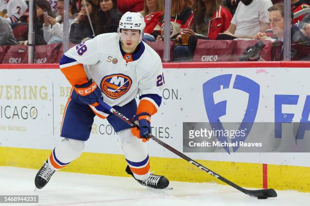 Alexander Romanov of the New York Islanders skates with the puck against the Chicago Blackhawks during the second period at United Center on November...