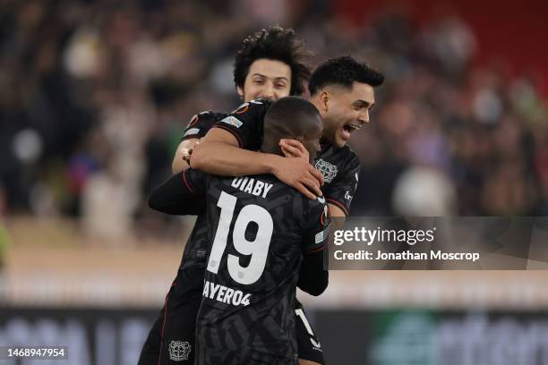 Moussa Diaby of Bayer Leverkusen is mobbed by team mates Sardar Azmoun and Nadiem Amiri after scoring the winning penlaty in the shoot out of the...