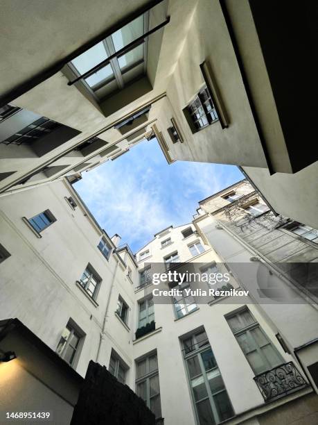 low angle view of buildings against sky -neighborhood concept - local high street stock pictures, royalty-free photos & images