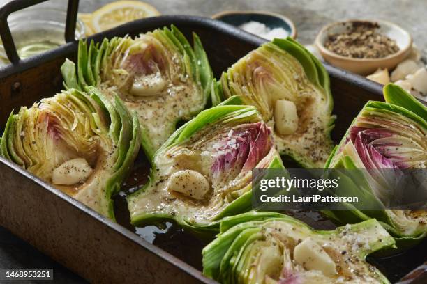 preparing roasted artichokes - artichoke stock pictures, royalty-free photos & images