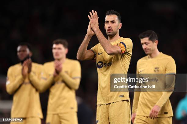 Sergio Busquets of FC Barcelona applauds the fans following the side's defeat in the UEFA Europa League knockout round play-off leg two match between...