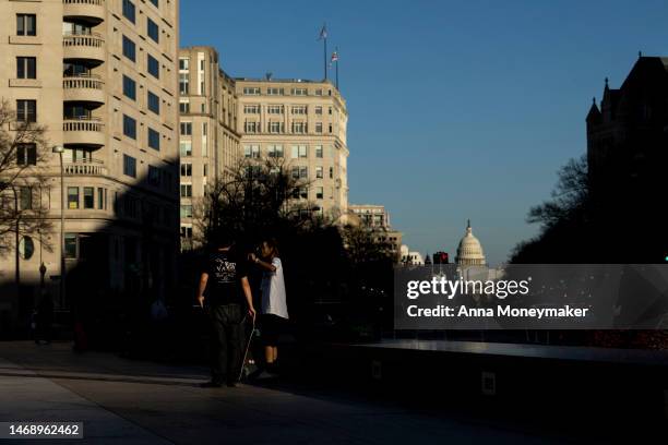 People skateboard on Freedom Plaza on February 23, 2023 in Washington, DC. Temperatures in parts of DC reached a high of almost 80 degrees,...