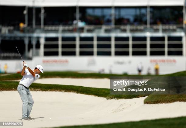 Ben Martin of the United States hits his second shot on the 18th hole during the first round of The Honda Classic at PGA National Resort And Spa on...