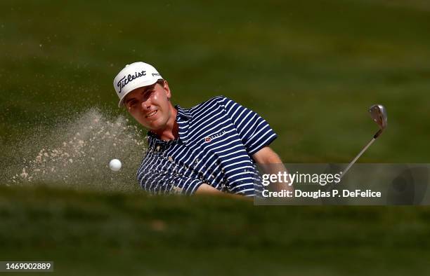 Ryan Gerard of the United States blasts from a bunker on the 10th hole during the first round of The Honda Classic at PGA National Resort And Spa on...