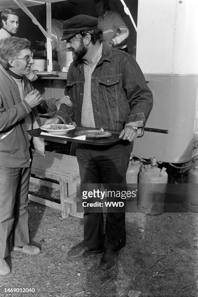 Juan Luis Bunuel takes a lunch break during production of 'Leonor' in Caceres, Spain, on November 20, 1974.