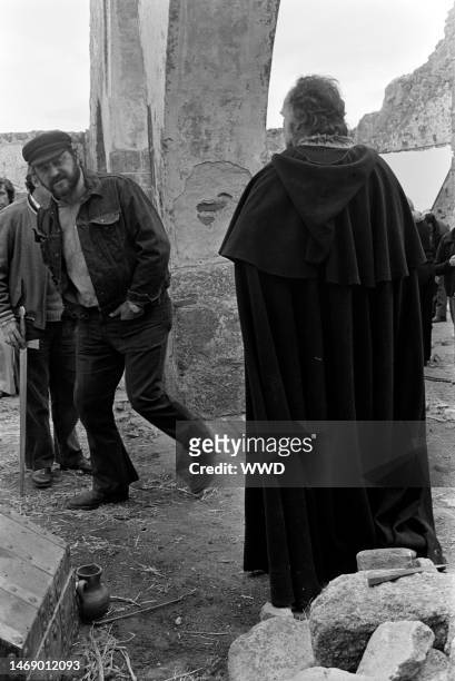 Juan Luis Bunuel and Michel Picooli prepare for filming during production of 'Leonor' in Caceres, Spain, on November 20, 1974.