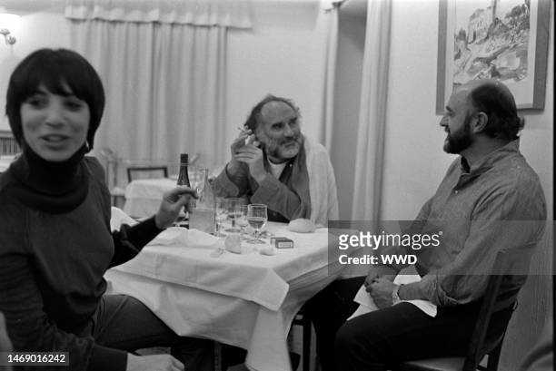 Michel Piccoli and Juan Luis Bunuel share a meal during production of 'Leonor' in Caceres, Spain, on November 20, 1974.