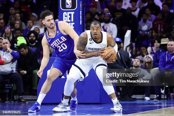 Georges Niang of the Philadelphia 76ers and Xavier Tillman of the Memphis Grizzlies challenge for the ball during the first quarter at Wells Fargo...