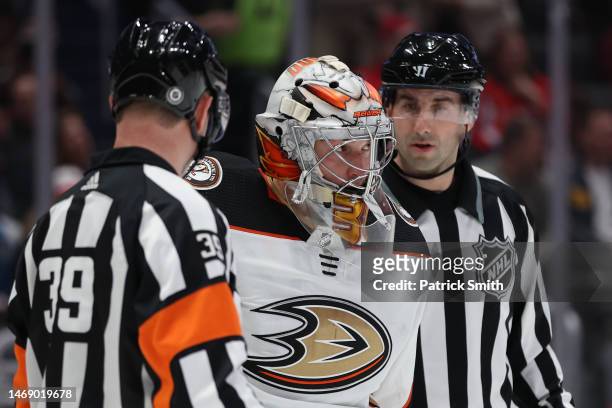 Goalie John Gibson of the Anaheim Ducks skates the bench after an equipment malfunction against the Washington Capitals during the second period at...