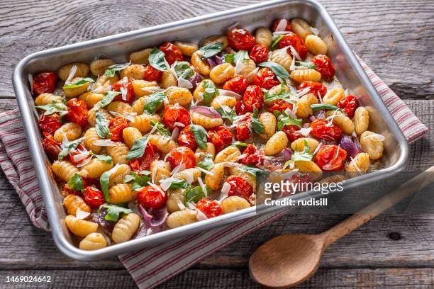 sheet pan gnocchi - baking tray stock pictures, royalty-free photos & images