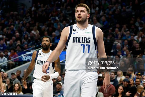 Luka Doncic and Kyrie Irving of the Dallas Mavericks watch a shot in the first half against the San Antonio Spurs at American Airlines Center on...