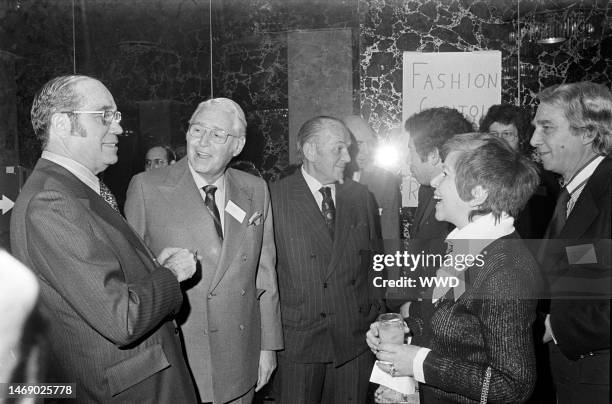 Sam Sandhaus, Dave Zelinka, Paul Honig, guest, and S.I. Newhouse, Jr. Confer at a Fashion Capital of the World, Inc. Runway show in New York.