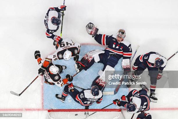 Goalie Charlie Lindgren of the Washington Capitals cannot make a save on a goal scored by Troy Terry of the Anaheim Ducks as players crash the net...