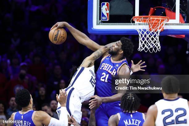 Joel Embiid of the Philadelphia 76ers blocks Ja Morant of the Memphis Grizzlies during the fourth quarter at Wells Fargo Center on February 23, 2023...