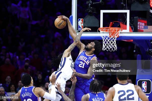 Joel Embiid of the Philadelphia 76ers blocks Ja Morant of the Memphis Grizzlies during the fourth quarter at Wells Fargo Center on February 23, 2023...