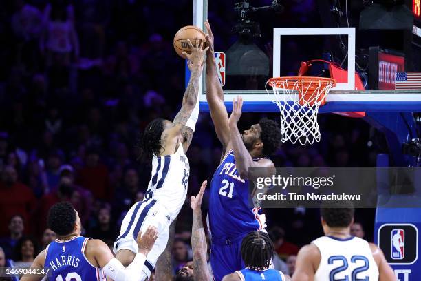 Joel Embiid of the Philadelphia 76ers blocks Ja Morant of the Memphis Grizzlies during the fourth quarter at Wells Fargo Center on February 23, 2023...