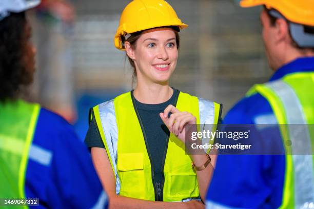 female warehouse manager in team meeting with employees about safety procedures and standards in all warehouse operations.the rules of work is keeping warehouse safety operations - software as a service stock pictures, royalty-free photos & images