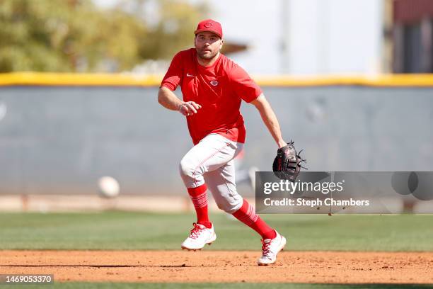 Joey Votto of the Cincinnati Reds fields a ground ball during a spring training workout at Goodyear Ballpark on February 23, 2023 in Goodyear,...