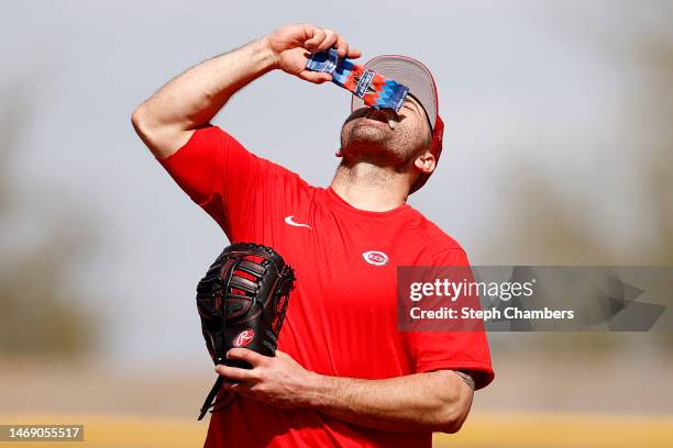 Joey Votto of the Cincinnati Reds eats sunflower seeds during a spring training workout at Goodyear Ballpark on February 23, 2023 in Goodyear,...