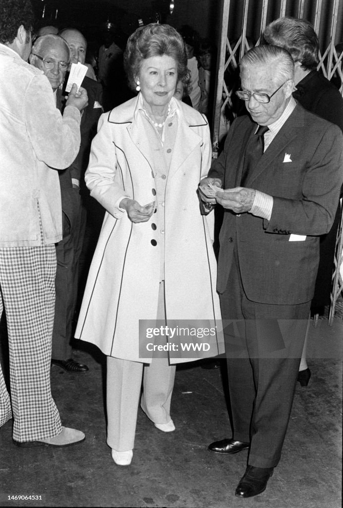 Jules Stein, Irene Dunne, and Francis Dennis Griffin attend Elton