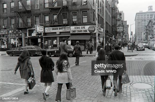 Pedestrians walk through New York City's East Village.