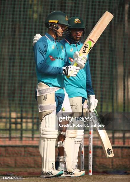 Alex Carey and Usman Khawaja of Australia are seen in the nets during an Australia Test squad training session at Arun Jaitley Stadium on February...
