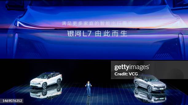 Jerry Gan Jiayue, CEO of Geely Automobile Group, speaks next to Geely Galaxy L7 hybrid SUV during the launching ceremony of Geely's new premium...