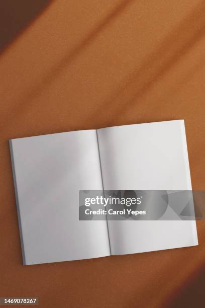 magazine template in orange abstract background - blank pages in open book overhead view stock pictures, royalty-free photos & images