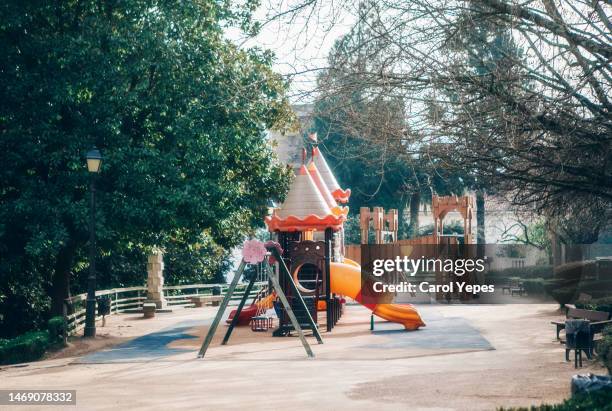 colorful kids outdoor playground equipment with slides - equipamento de lazer - fotografias e filmes do acervo