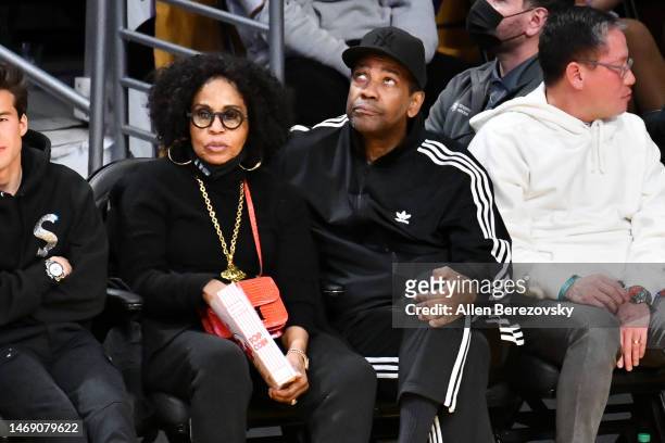 Denzel Washington and Pauletta Washington attend a basketball game between the Los Angeles Lakers and the Golden State Warriors at Crypto.com Arena...