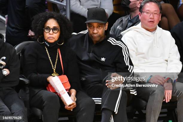 Denzel Washington and Pauletta Washington attend a basketball game between the Los Angeles Lakers and the Golden State Warriors at Crypto.com Arena...