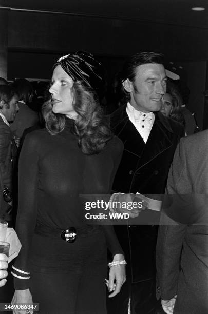 Paulene Stone and Laurence Harvey attend an event benefiting the Thalians at the Century Plaza Hotel in Los Angeles, California, on October 9, 1972.