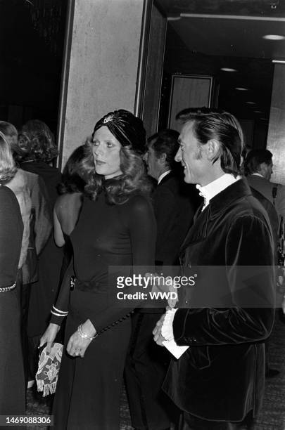 Paulene Stone and Laurence Harvey attend an event benefiting the Thalians at the Century Plaza Hotel in Los Angeles, California, on October 9, 1972.