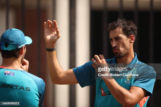 Lance Morris of Australia speaks with Mitchell Starc during an Australia Test squad training session at Arun Jaitley Stadium on February 24, 2023 in...