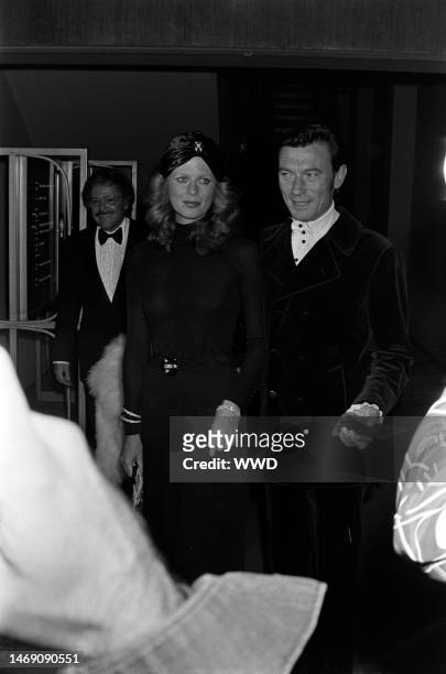 Paulene Stone and Laurence Harvey attend an event benefiting the Thalians at the Century Plaza Hotel in Los Angeles, California, on October 9, 1972.