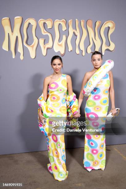 Hala Alasmari and Julia Hussein are seen on the front row of the Moschino fashion show during the Milan Fashion Week Womenswear Fall/Winter 2023/2024...