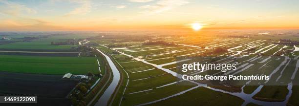 aerial photo of peat meadows in holland at sunset - peat stock pictures, royalty-free photos & images