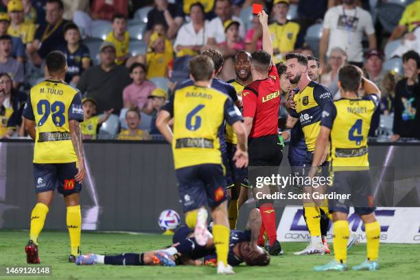 Referee Jack Morgan gives Brian Kaltak of the Mariners a red card during the round 18 A-League Men's match between Central Coast Mariners and...