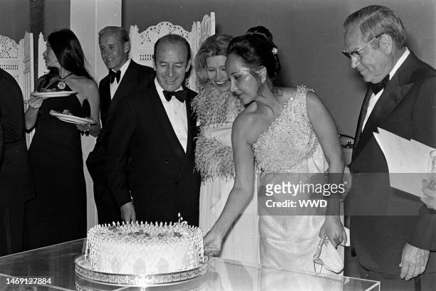 Jennifer Longoria , Bruno Pagliai , and Merle Oberon attend a party for the movie 'Interval' in Mexico City on the weekend of March 3-4, 1973.