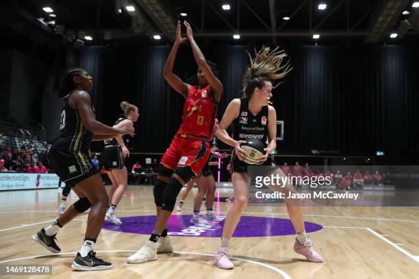 Jacinta Monroe of the Lightning and Keely Froling of the Flames during the round 15 WNBL match between Sydney Flames and Adelaide Lightning at Quay...