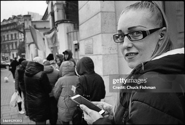 Marta Anadelvna, from Lviv, with other Ukrainian refugees waiting for the gates of JCC Krakow to open, allowing access to its free distribution...